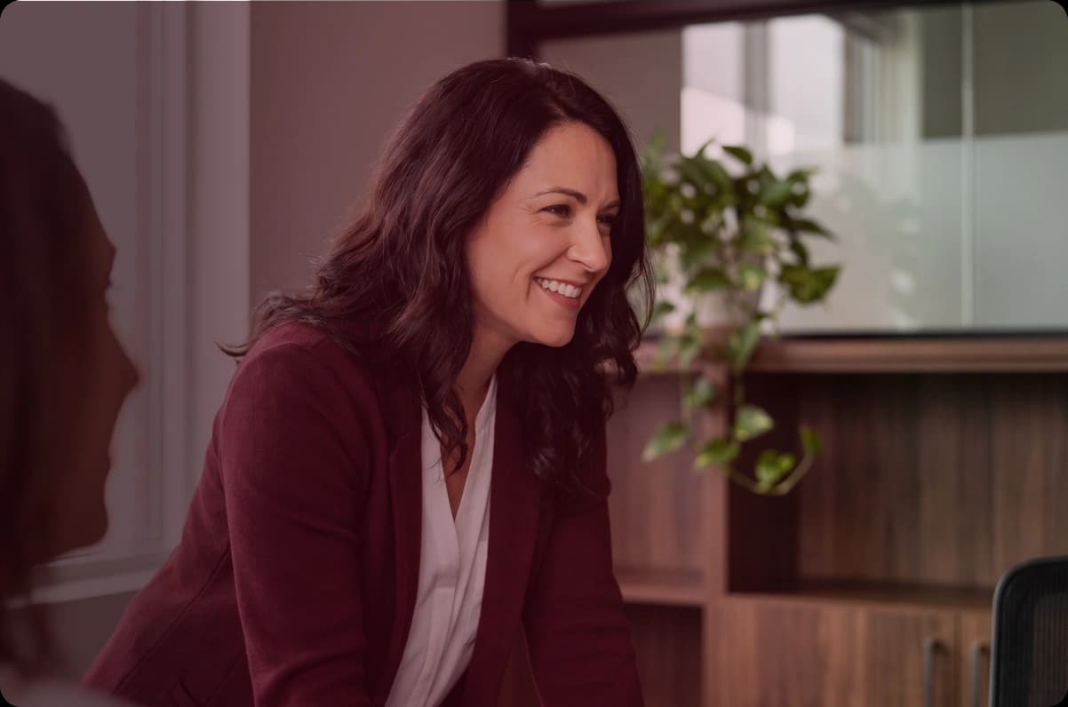 An insurance professional speaking with colleagues