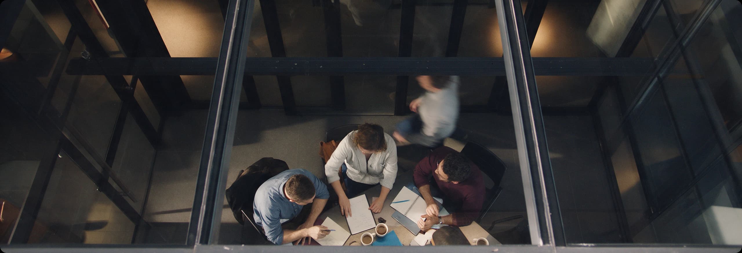 A team working together around a table, seen from above